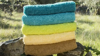 COMPARING ABYSS LUXURY TOWELS: SUPER PILE, TWILL AND SUPER TWILL Fine Linens in Forrest Nature on Rocks