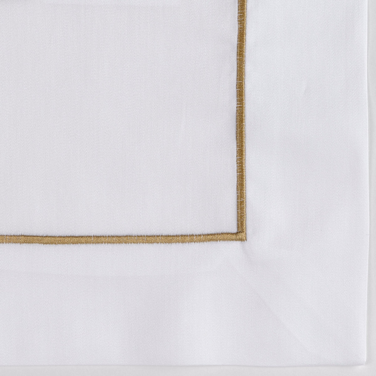 Closeup of Fabric of Celso de Lemos Bourdon Bedding Gold Color