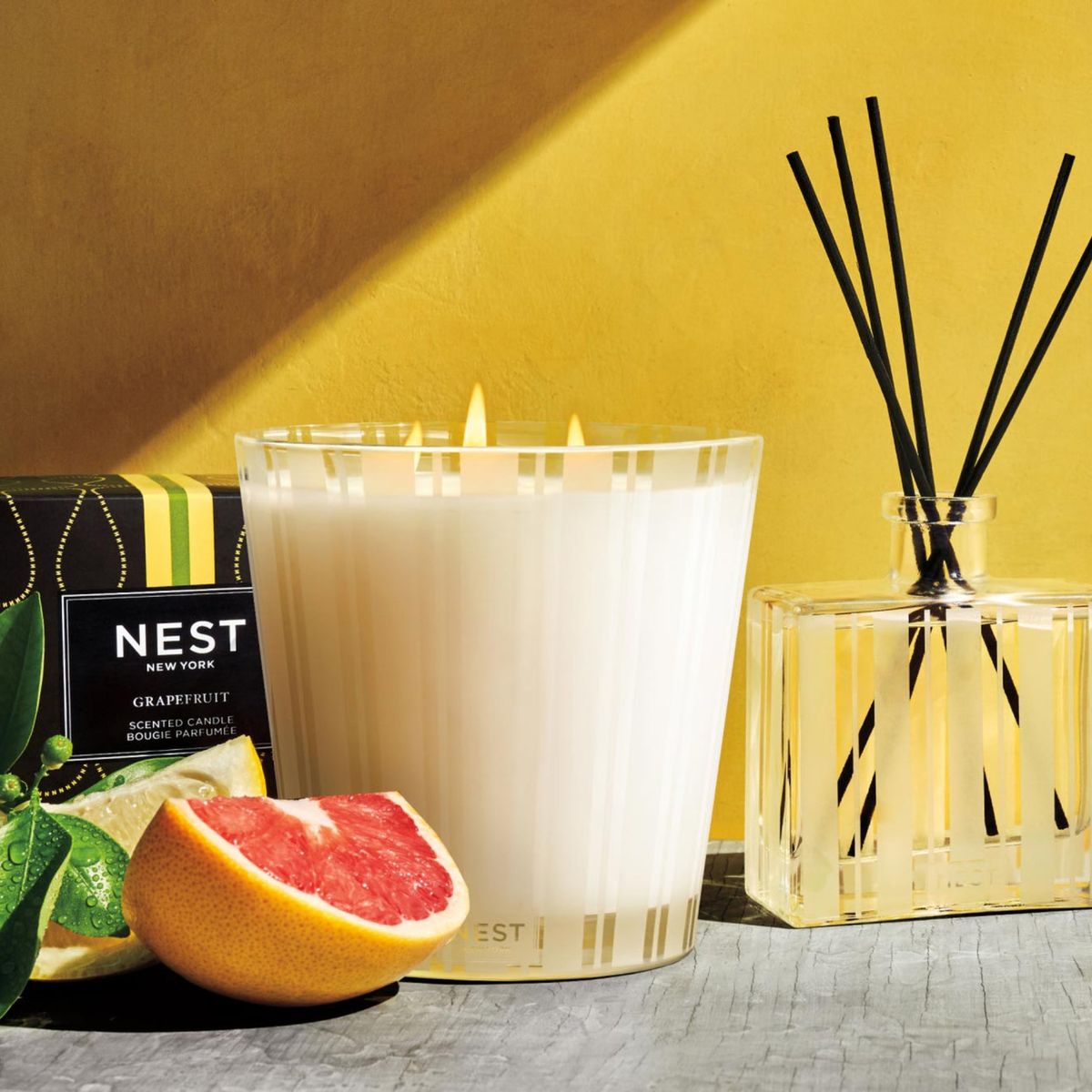 Lifestyle Photo of Nest New York’s Grapefruit 3-Wick Candle with Reed Diffuser