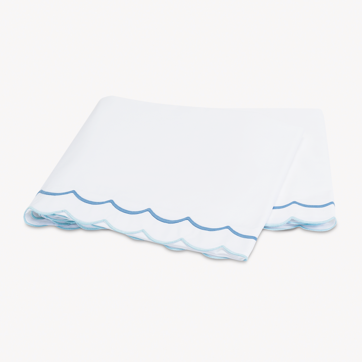 Folded Flat Sheet of Matouk India Bedding in Azure