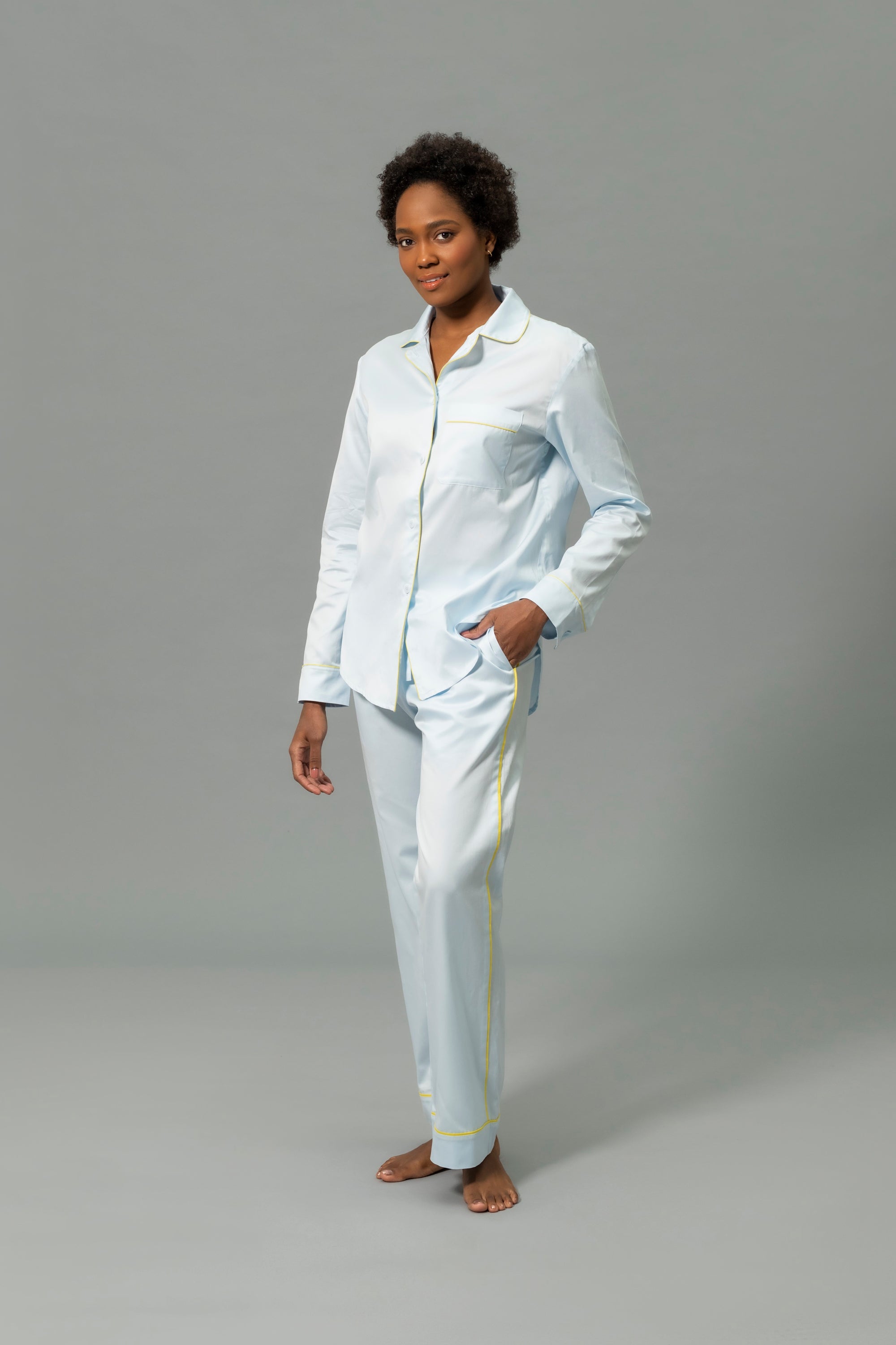 Front View of Model Wearing Matouk Nocturne Pajama Set in Color Blue and Lemon