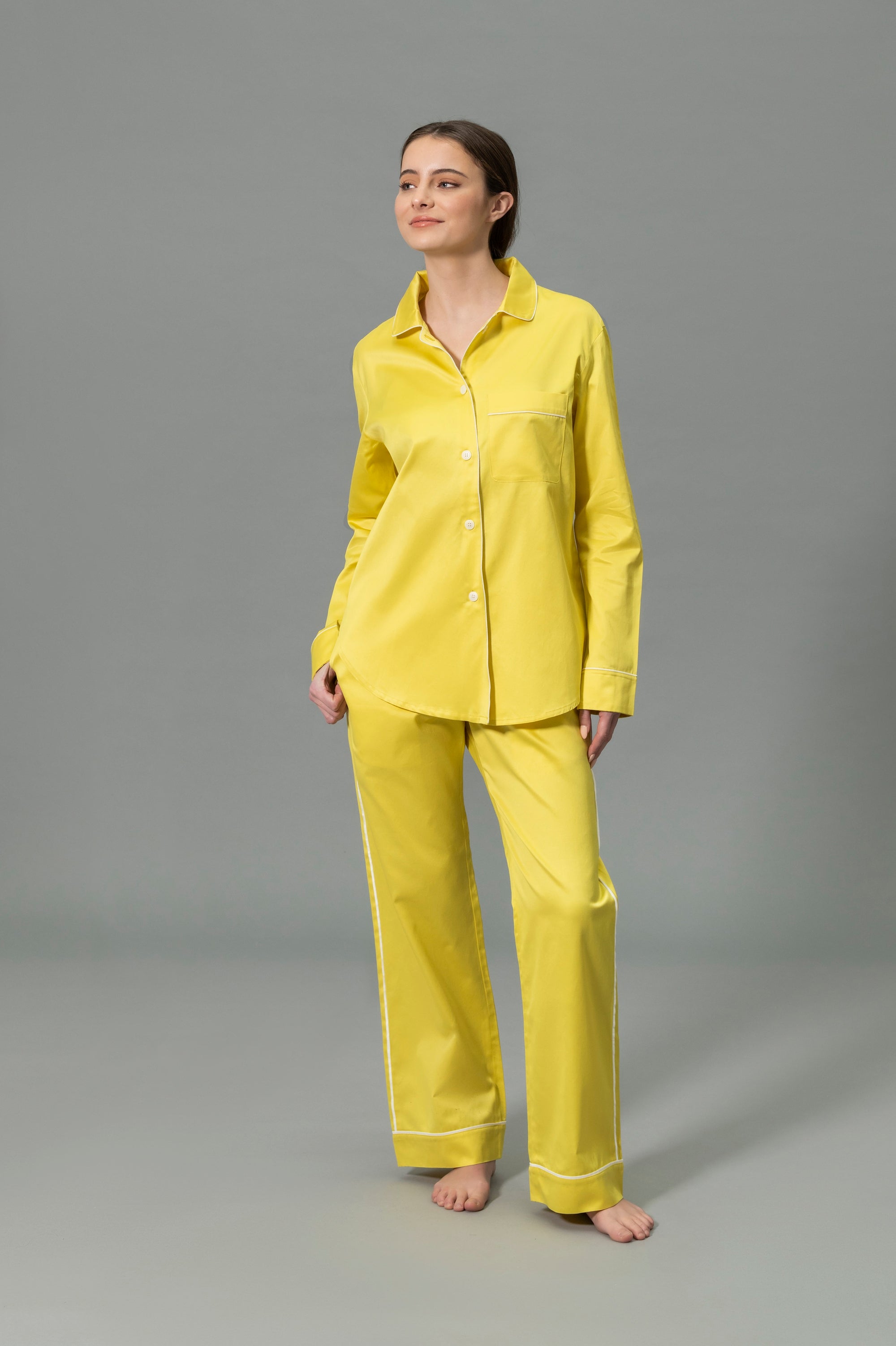 Front View of Model Wearing Matouk Nocturne Pajama Set in Color Lemon and Bone