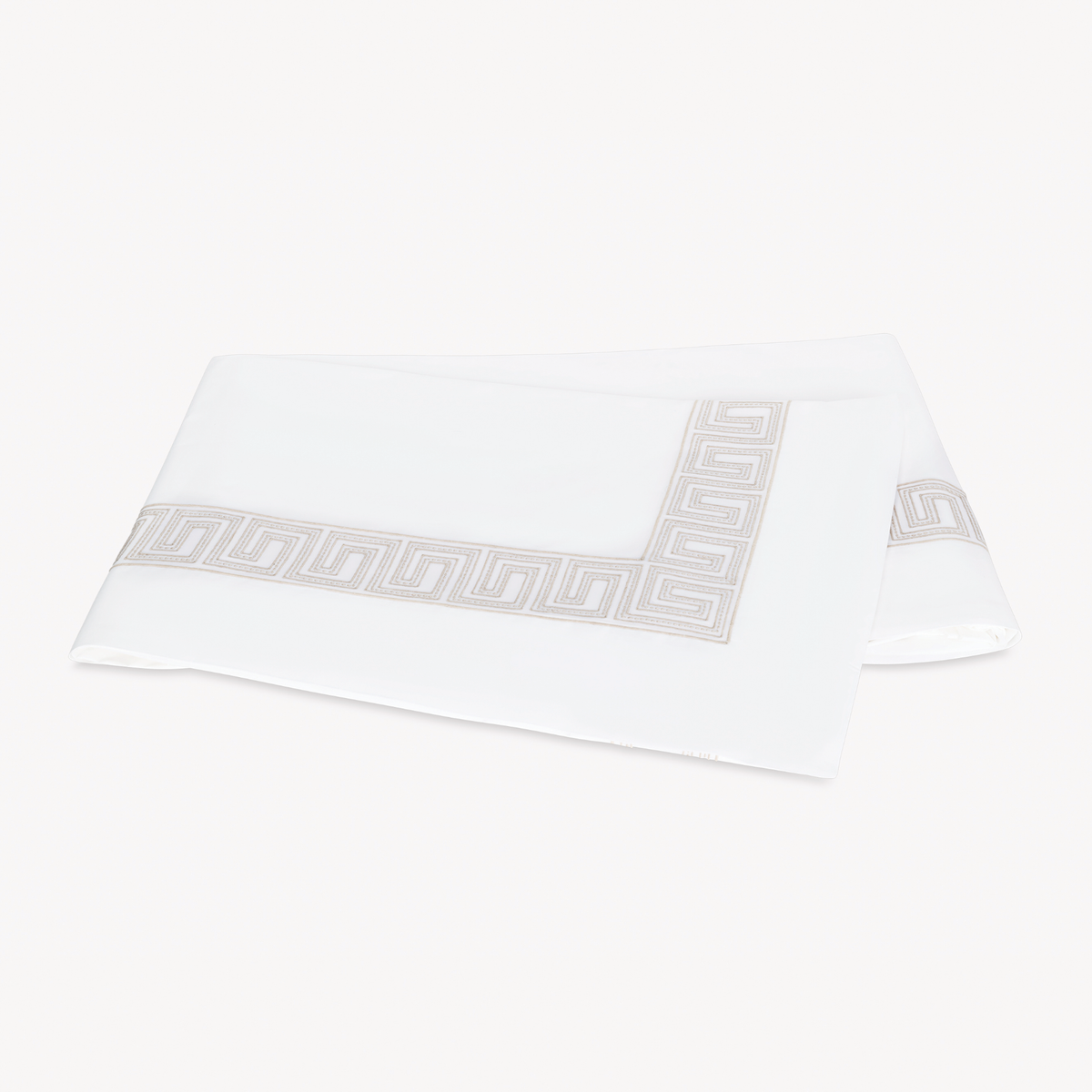 Folded Flat Sheet of Matouk Schumacher Ophelia Bedding in Dune