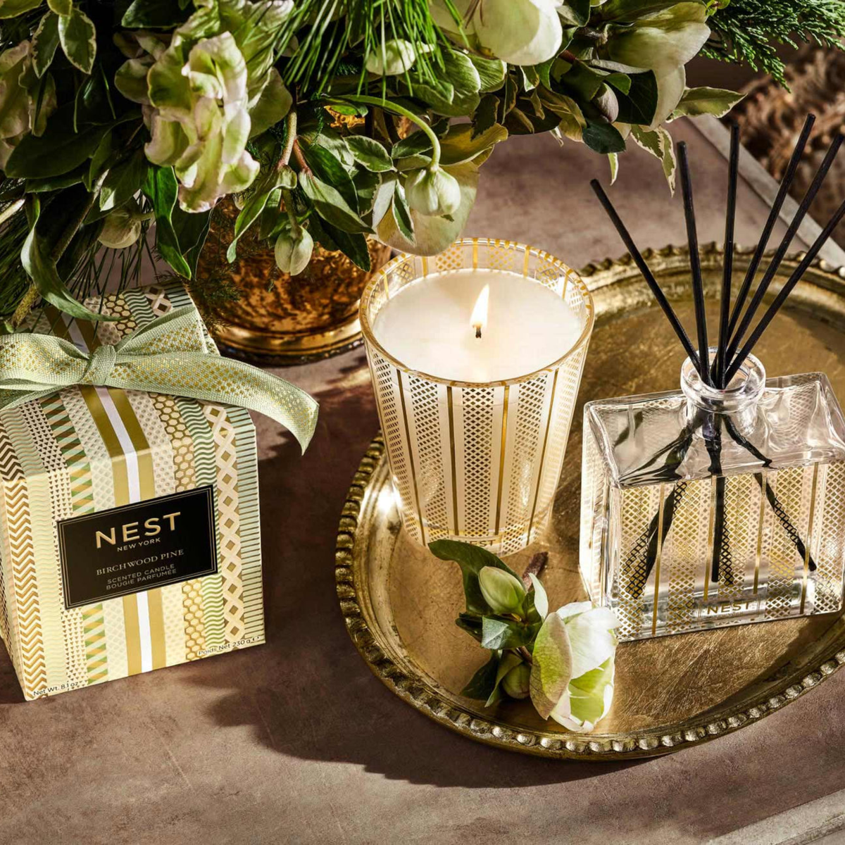 Topview of Nest New York Birchwood Pine Reed Diffuser Lifestyle with Classic Candle and Box