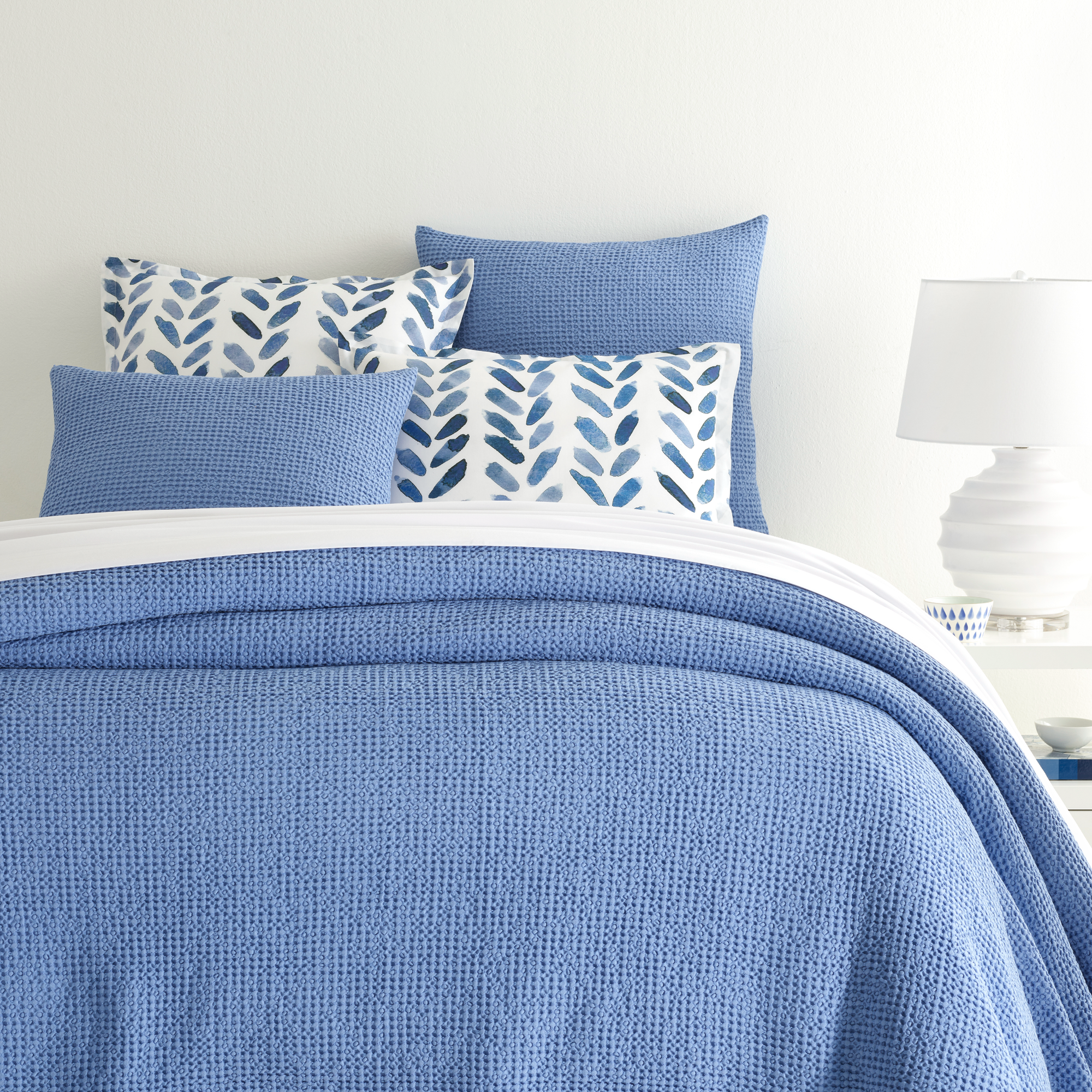 Closeup of Bed in French Blue Pine Cone Hill Bubble Matelassé Coverlet & Shams