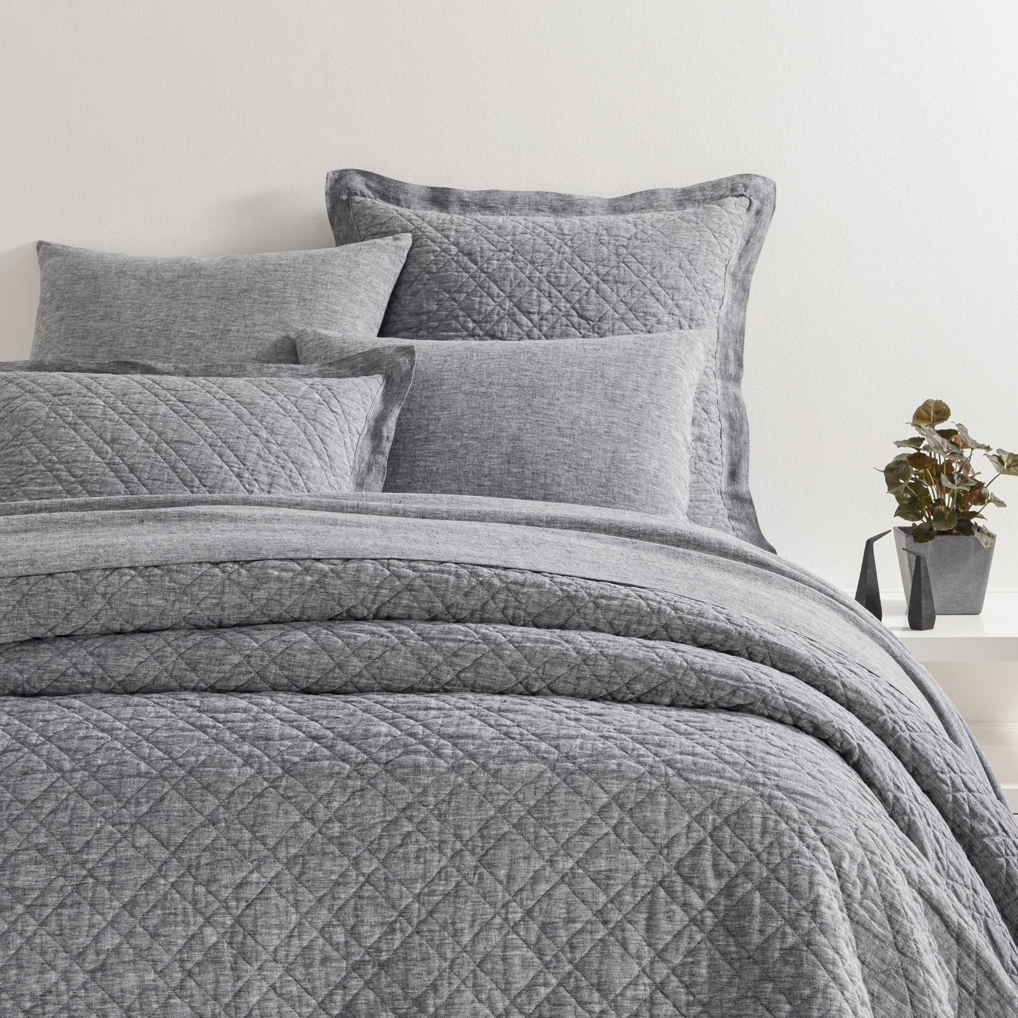 Corner Shot of Pine Cone Hill Washed Linen Quilted Bedding in Color Black