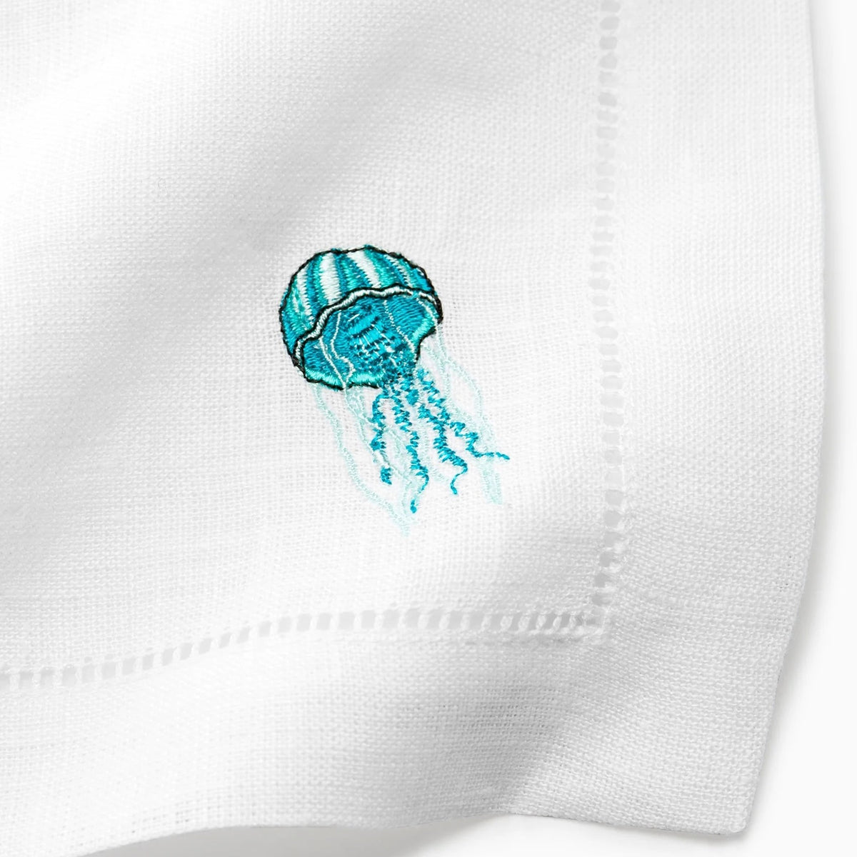 Close Up Shot of Sferra Amalfi Cocktail Napkins with Embroidered Jellyfish