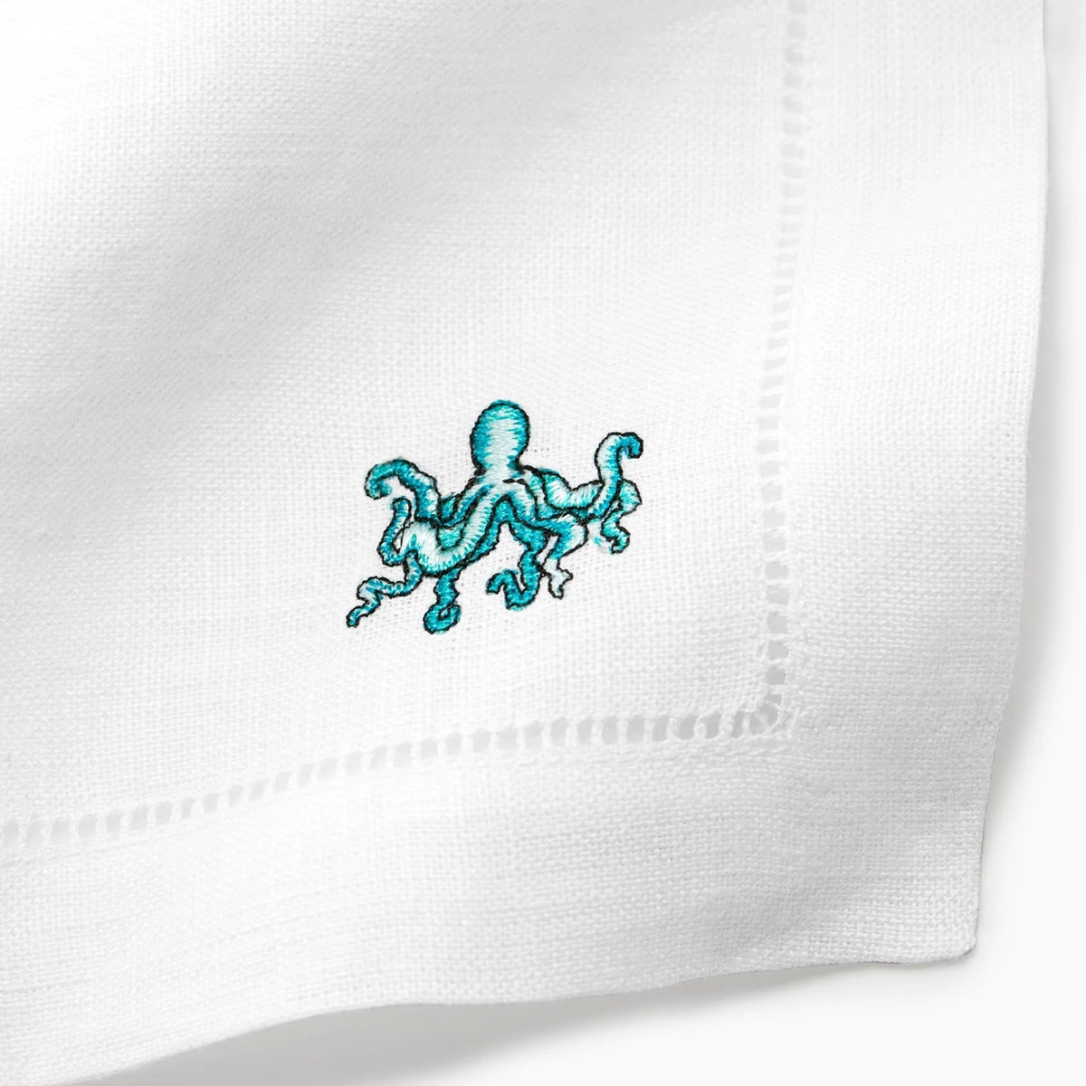 Close Up Shot of Sferra Amalfi Cocktail Napkins with Embroidered Octopus