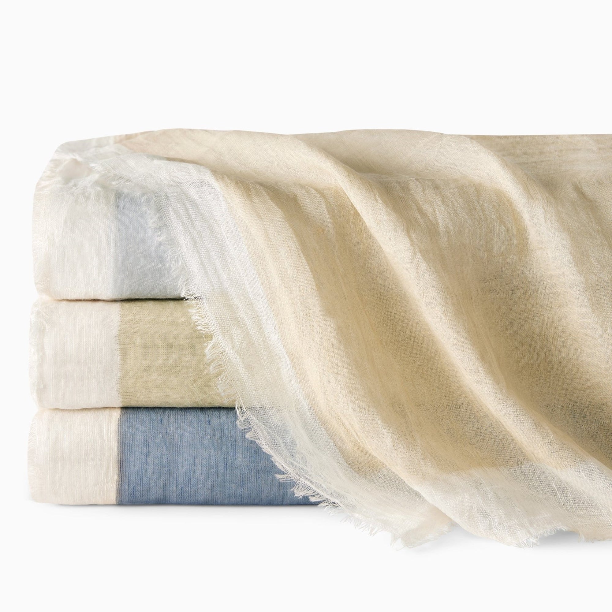 Stack of Sferra Pitura Throw Blanket in Different Colors