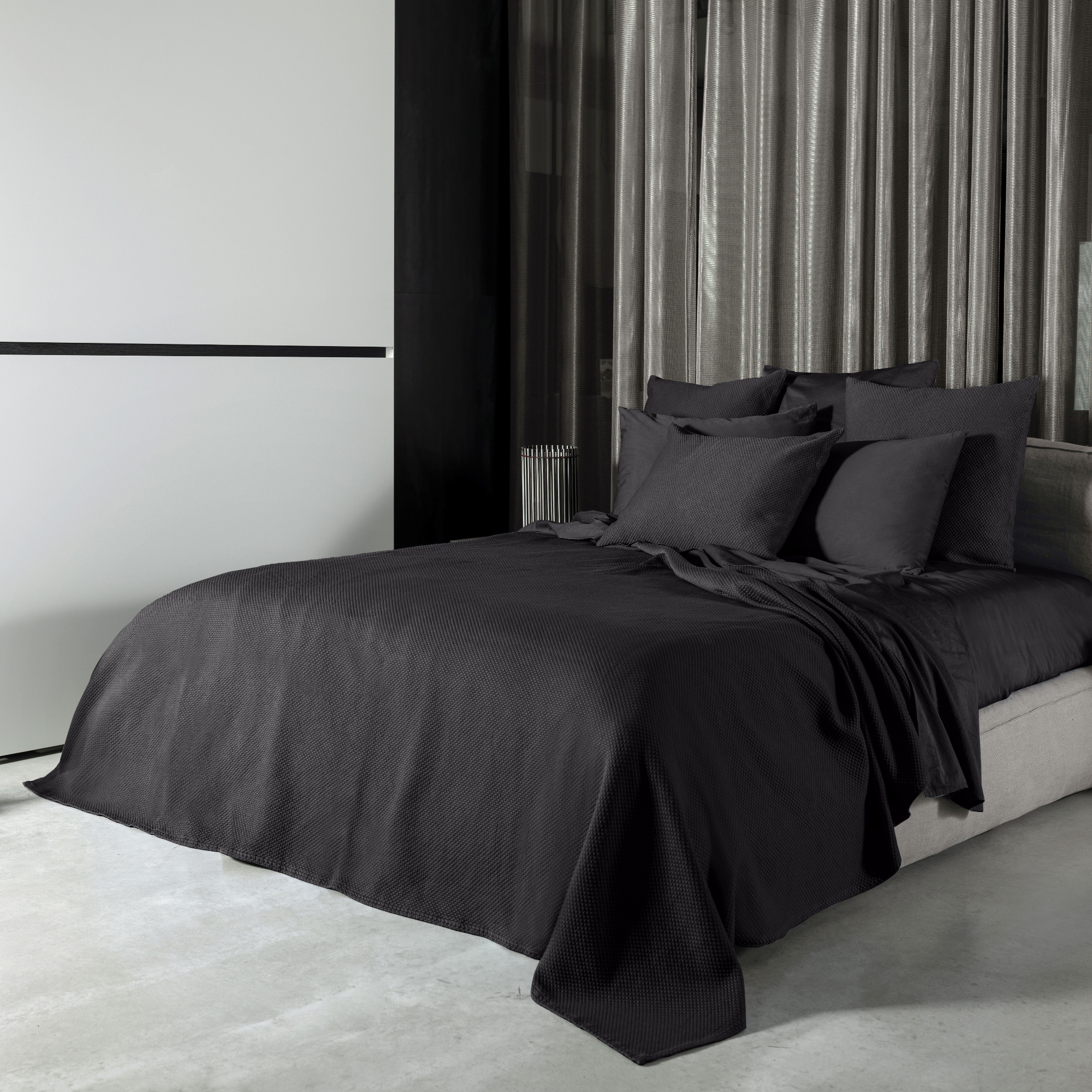 Charcoal Signoria Olivia Coverlet and Shams on a Bed in a Room