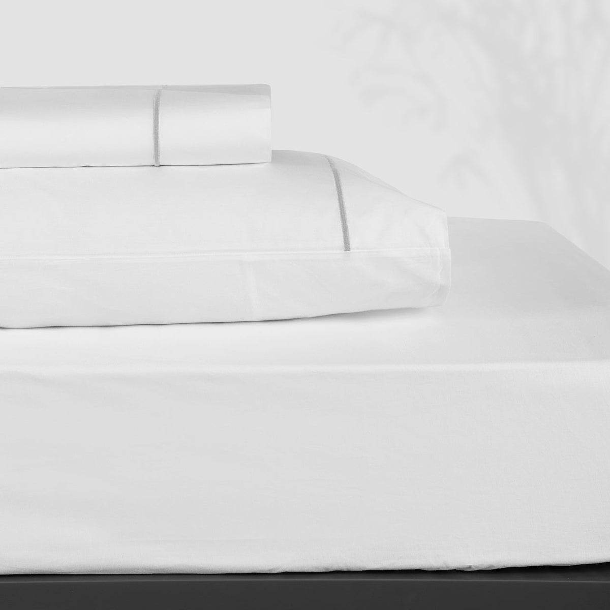 Stack Silos of Folded BOVI Classic Hotel Bedding Sheet Set White/Grey Fine Linens