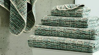 The 2021 Bath Towel and Bath Mat Collection from Abyss Habidecor Piled Folded and Hung Fine Linens