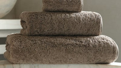 Graccioza Towel Buyer's Guide: Bee Waffle vs. Long Double Loop vs. Egoist Folded Piled On Marble Counter With Sink