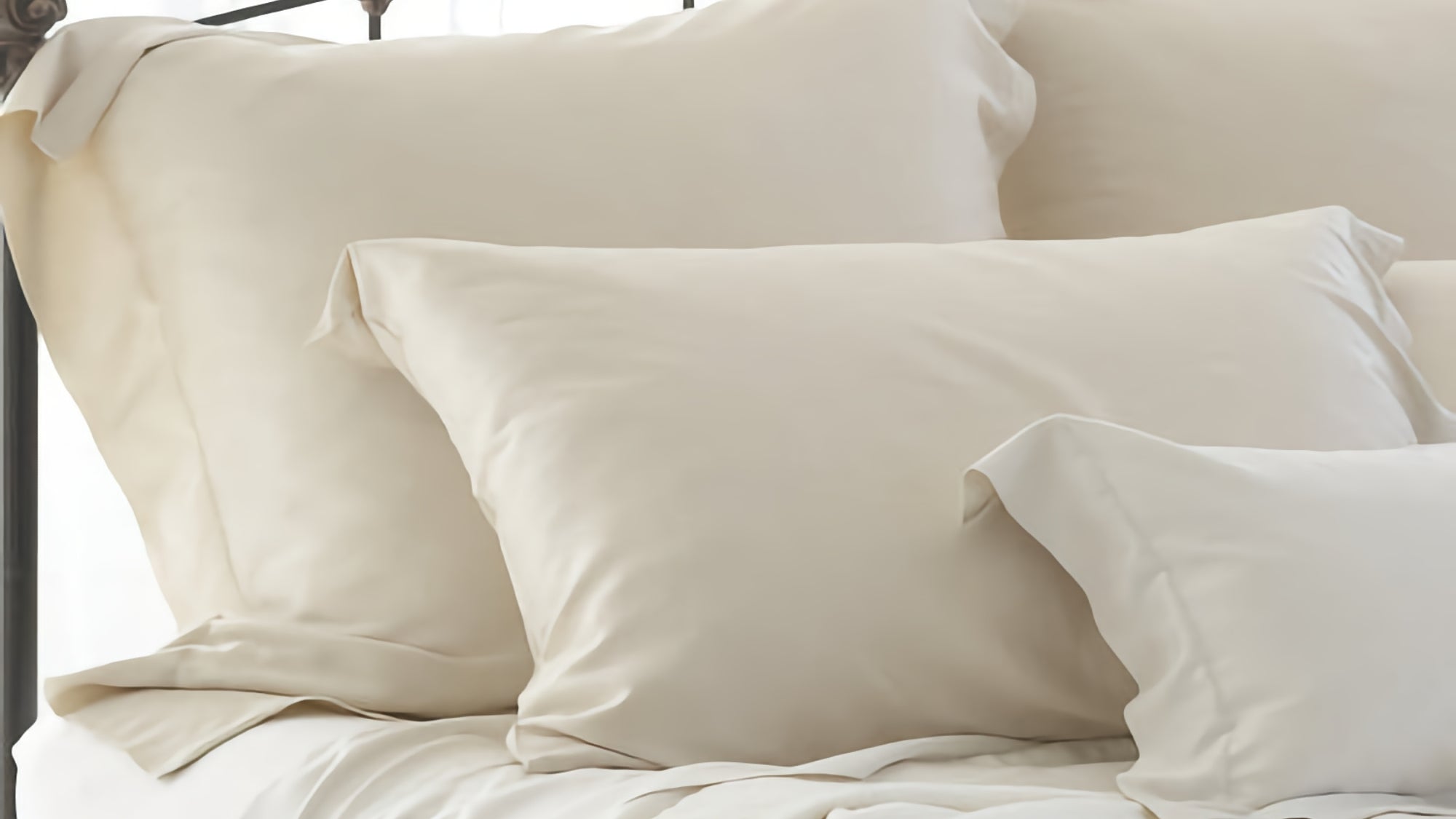 White fine linen pillows and shams on a bed