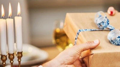 Hanukkah gift giving Candles Lit in Menorah 