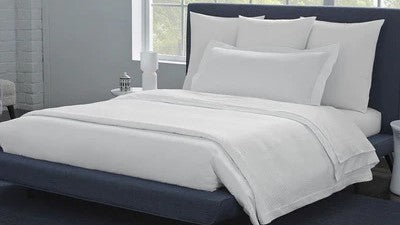 SFERRA Celeste Sheet Buyers Guide: Luxury Percale Sheet Comparison Fine Linens Pillows on Bed in Bedroom