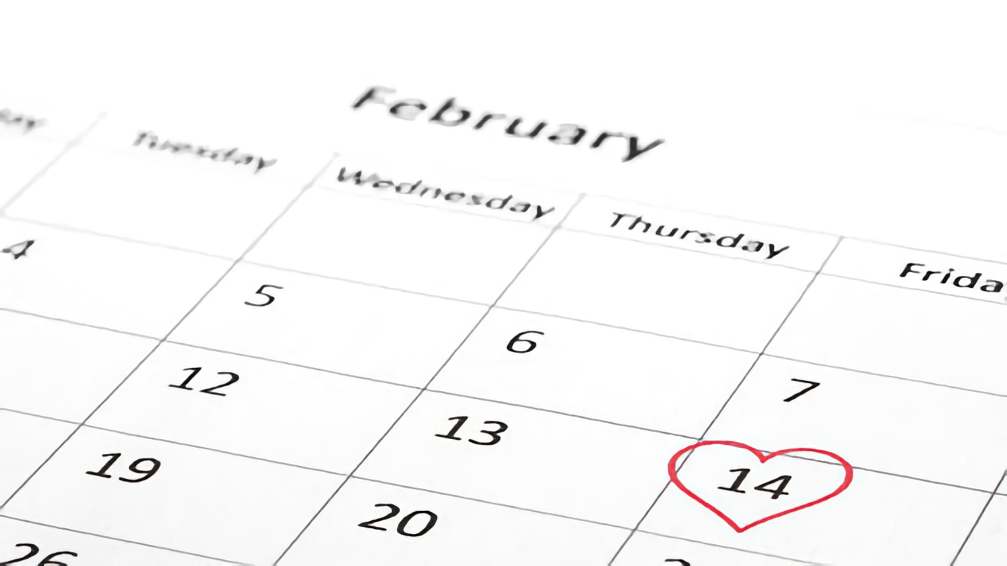 Calendar with day of February 14th inside a heart red outline