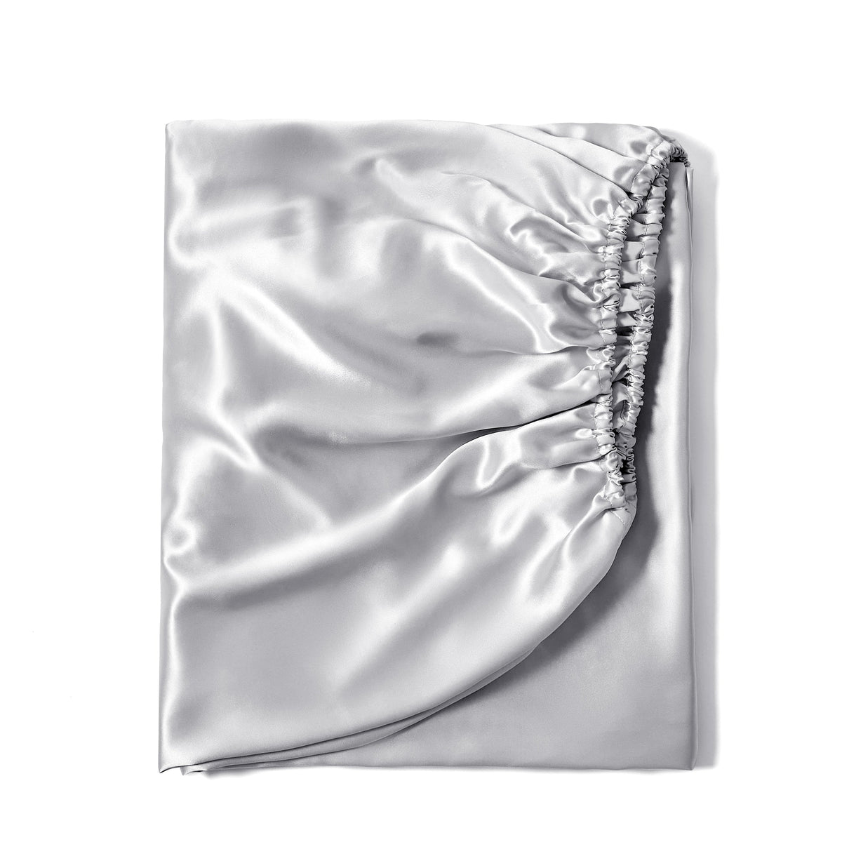 Luxurious 22 Momme silk fitted bed sheet in Silver, neatly folded for fabric display