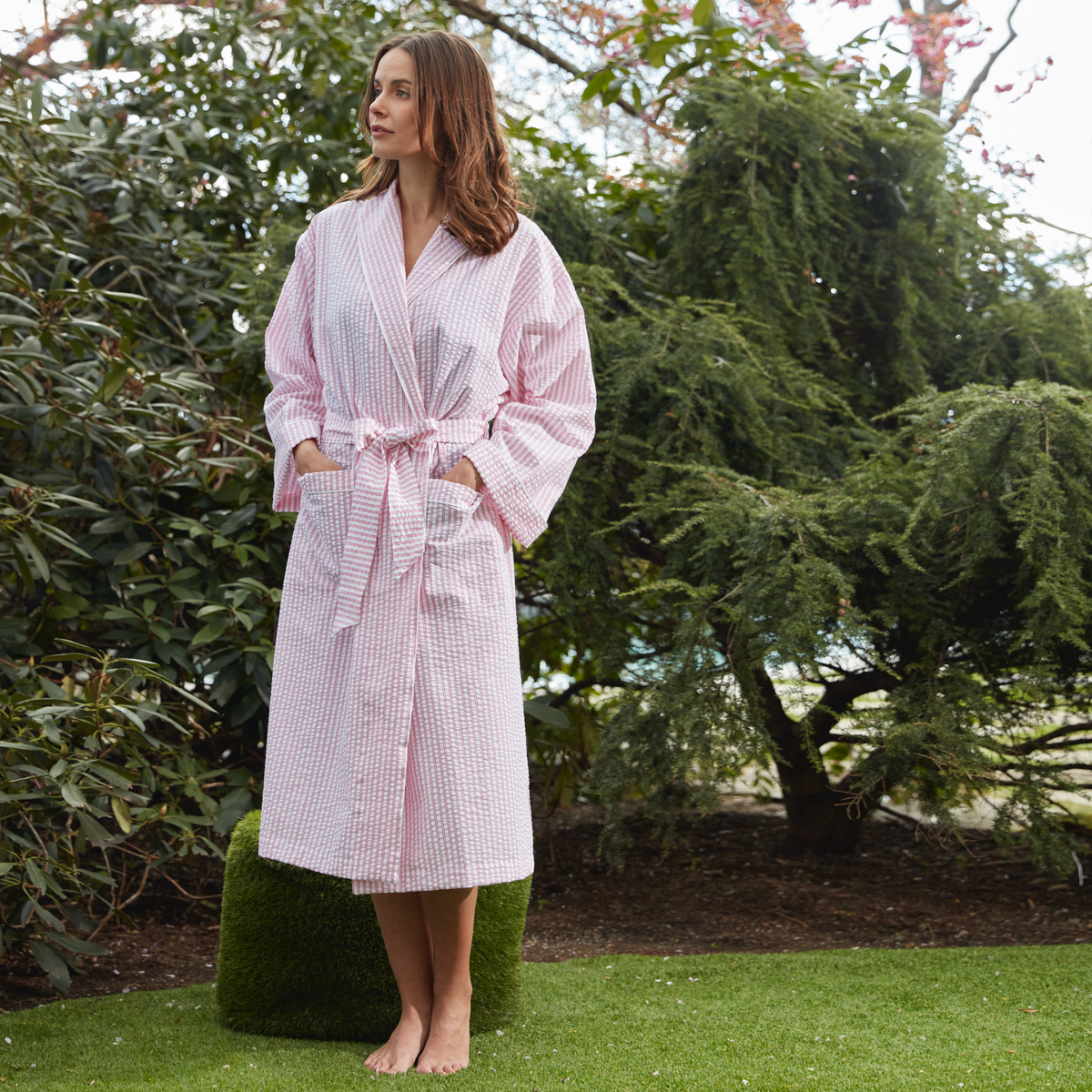 A 5” 11 inches Tall Female Model Wearing a Size Small Matouk Matteo Robe in Peony Color