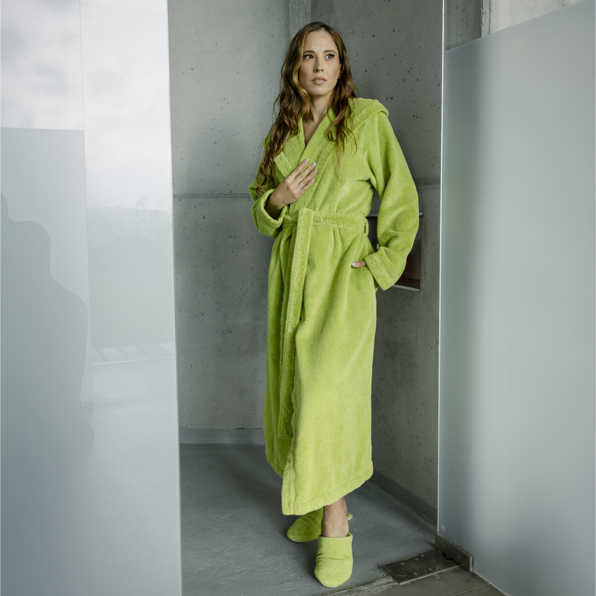 Lifestyle Shot of Female Model Wearing Abyss Alex Bath Robes in Apple Green Color