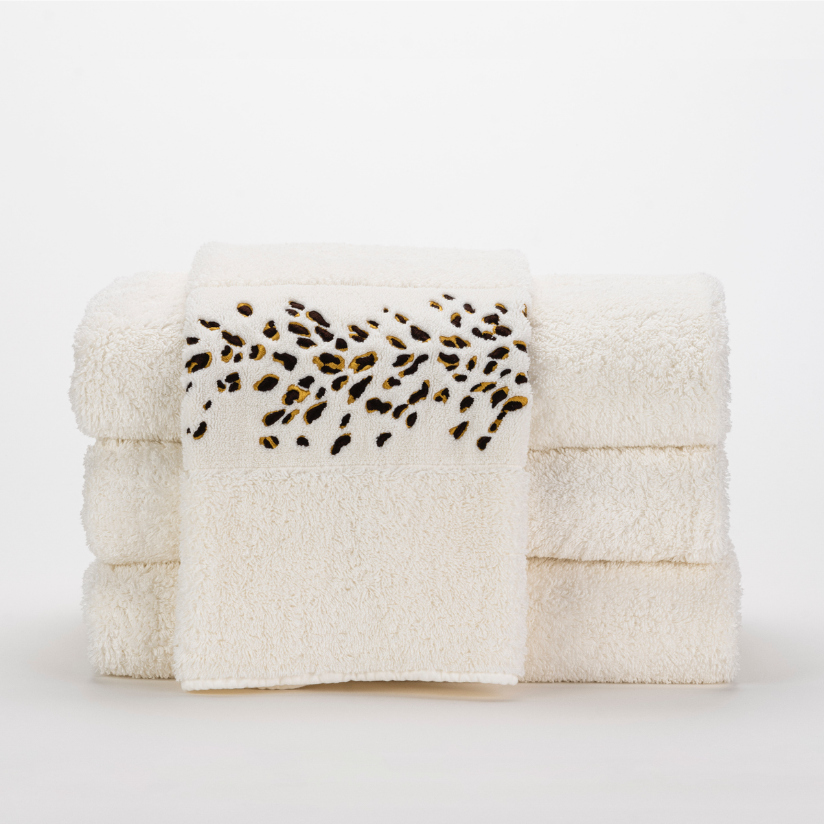 Stack of Abyss Bengale Hand Towels in Gold Color