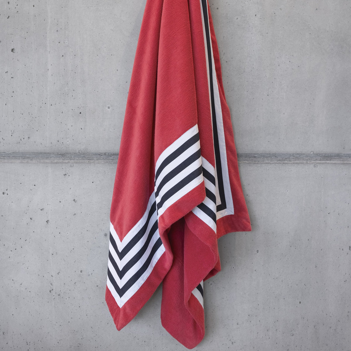 Viva Magenta Abyss Cannes Beach Towels Hung on the Wall