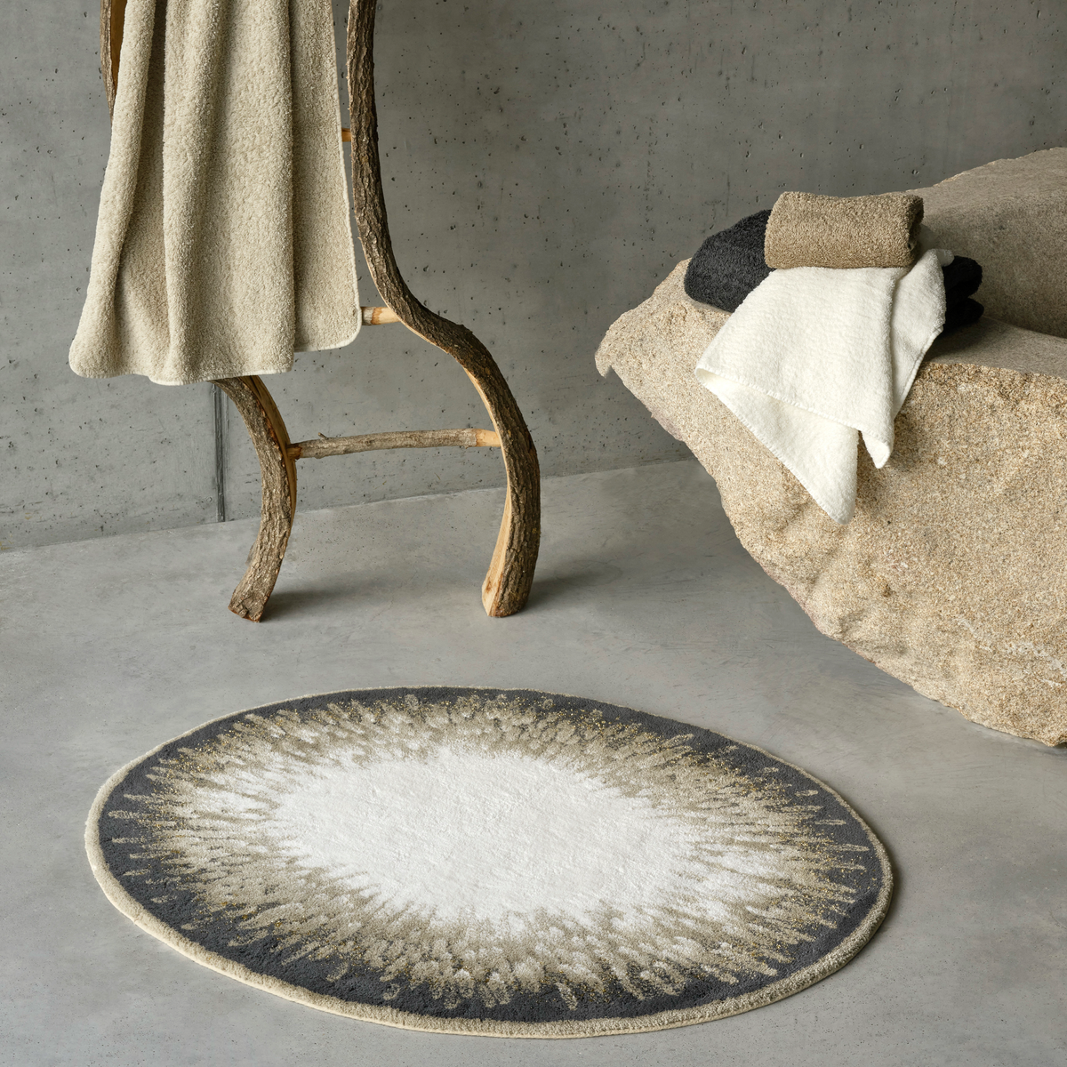 Taupe colored Abyss Habidecor Atom Bath Rug with towels matching in color