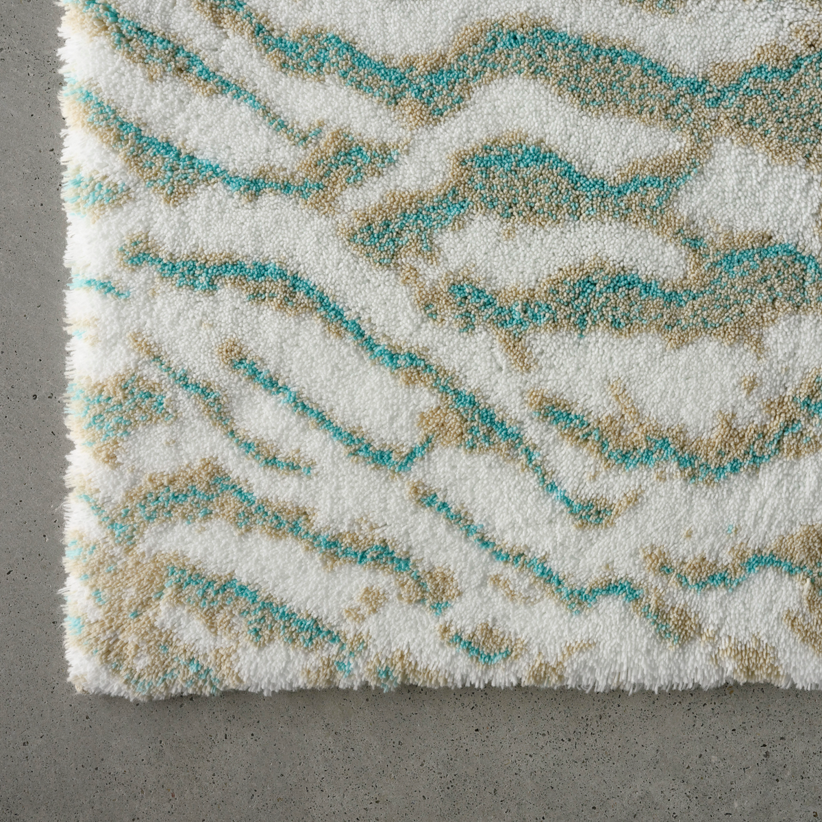 Closeup of Turquoise colored Abyss Habidecor Beach Bath Rug