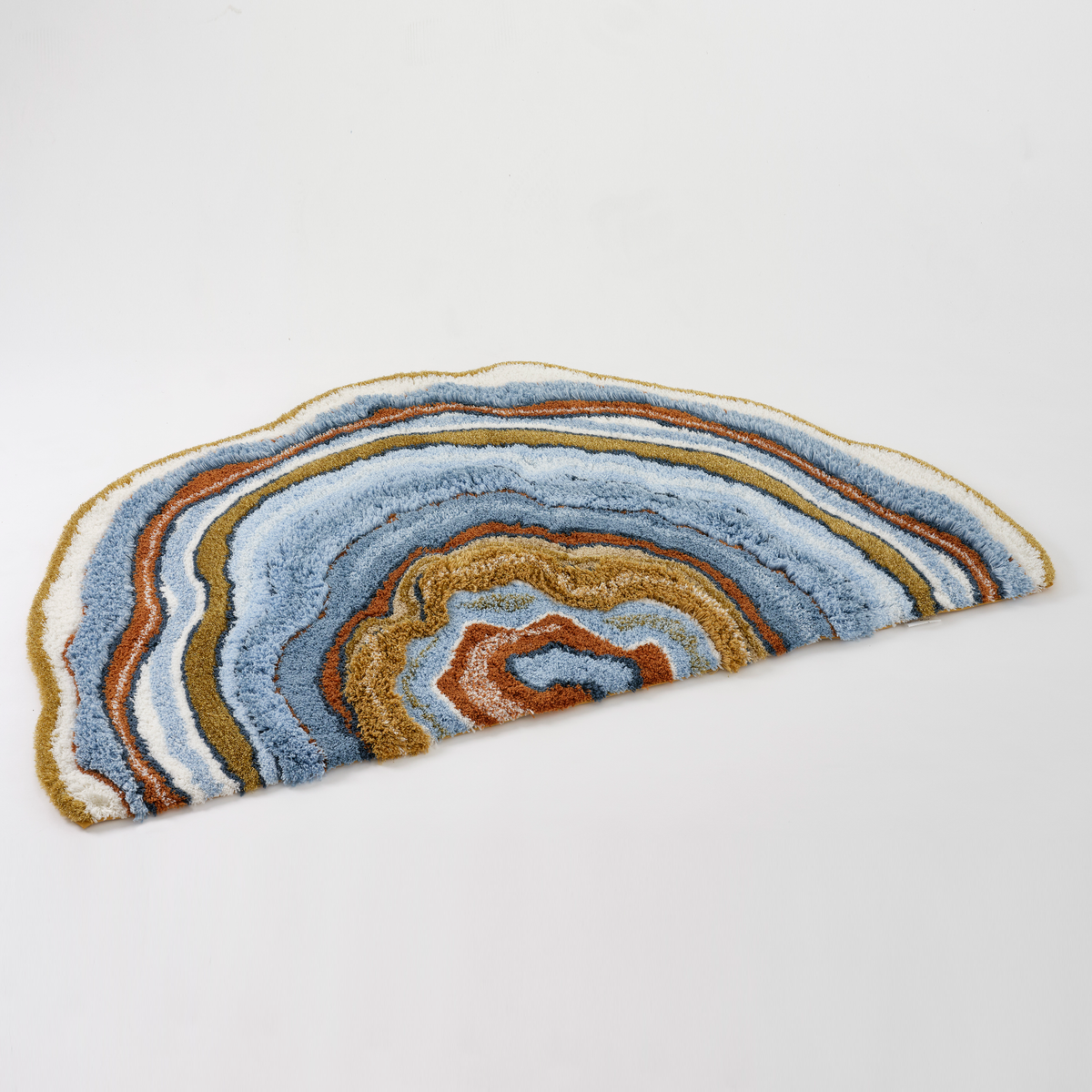 Angled view of Powder Blue colored Abyss Habidecor Celora Bath Rug
