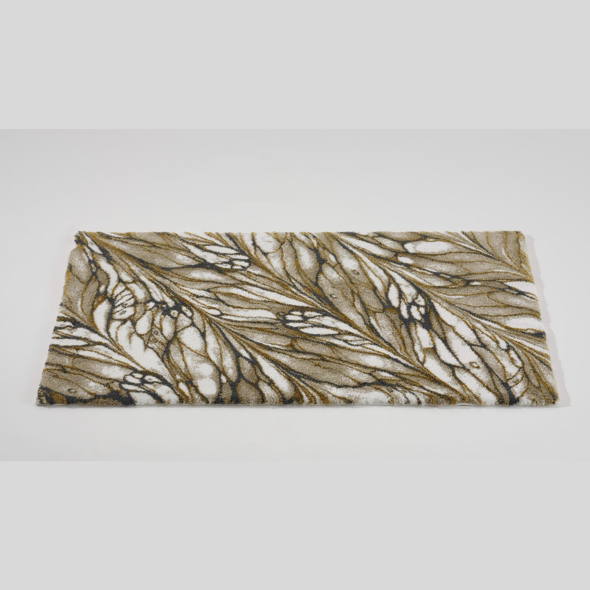 Side way view of Gold Abyss Habidecor Diane Bath Rug