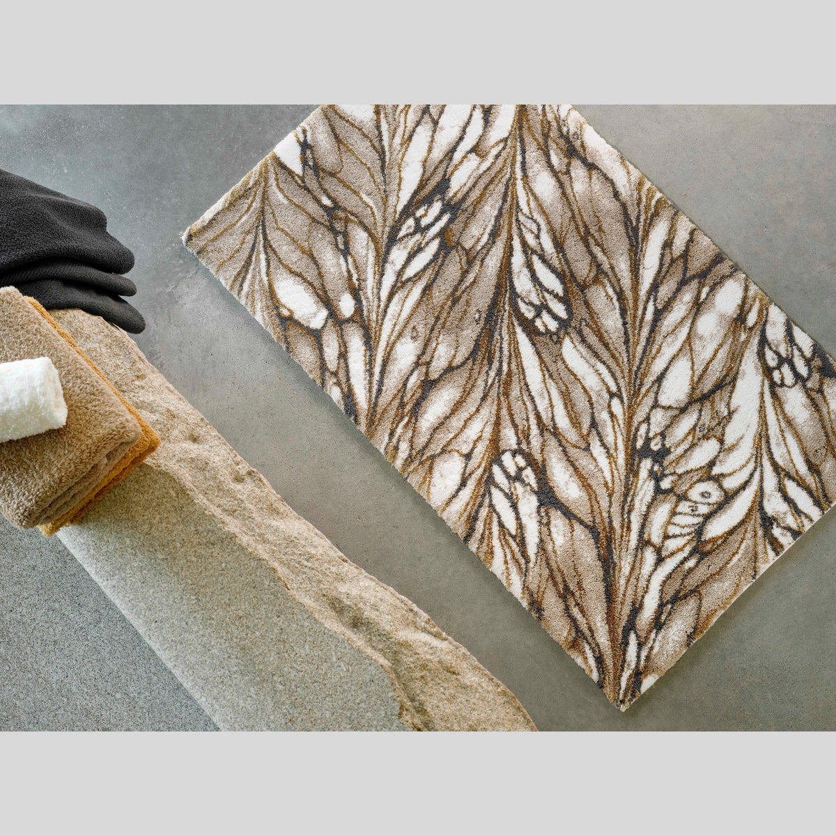 Gold Abyss Habidecor Diane Bath Rug on bathroom floor