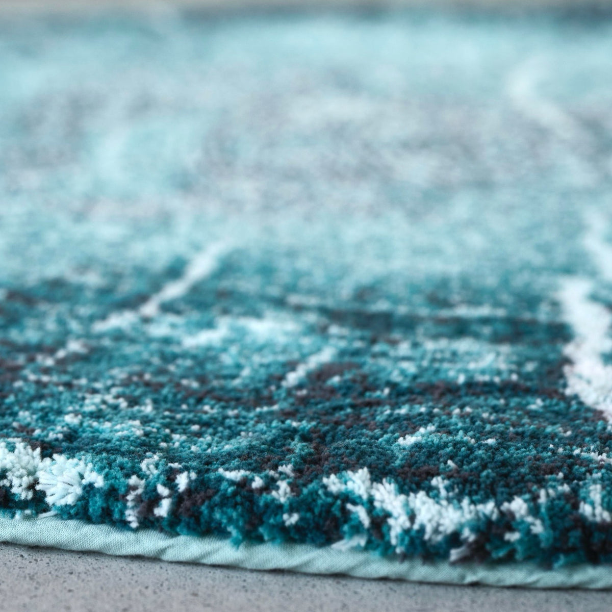 Fabric Closeup of Dragonfly Abyss Habidecor Fossile Bath Rug