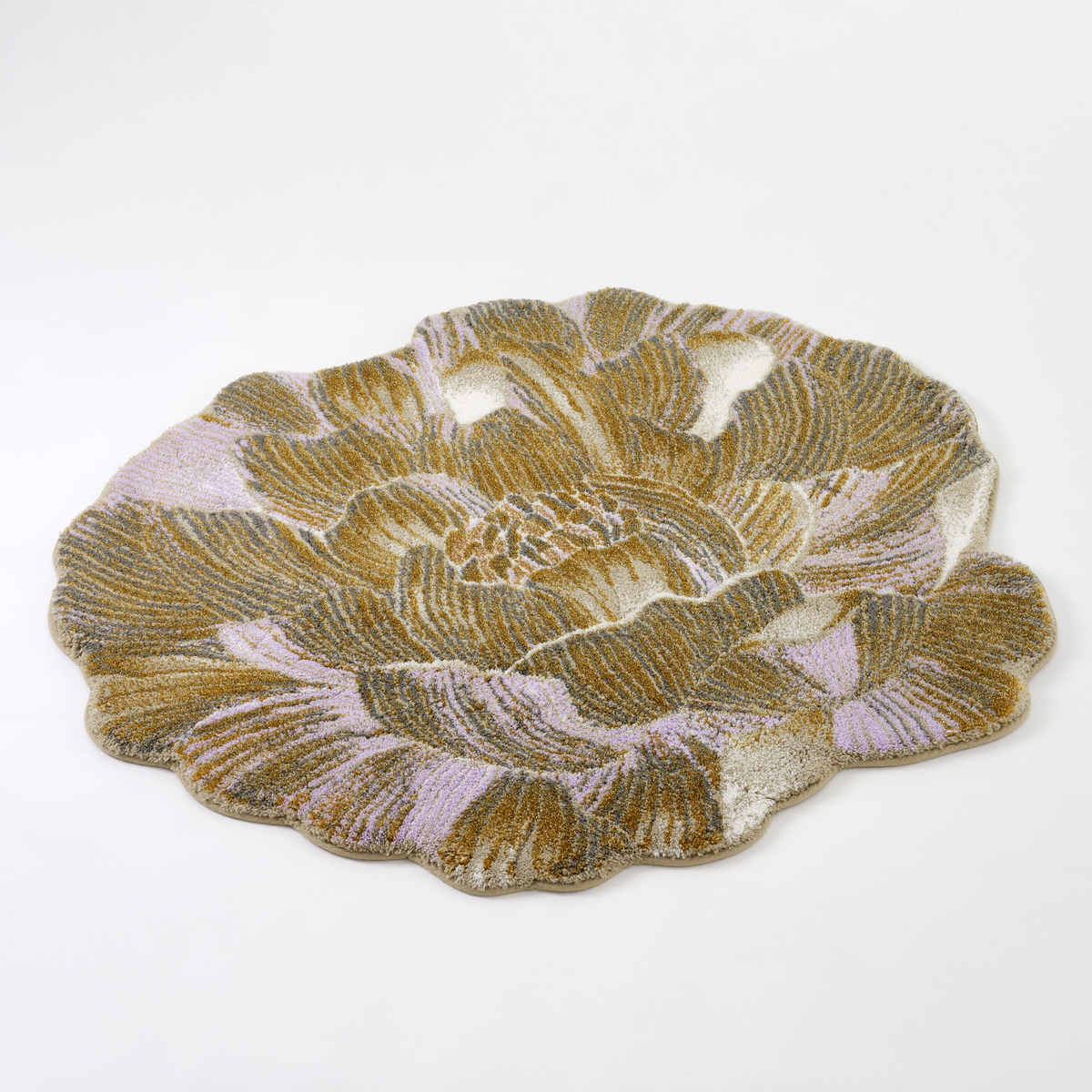 Angled view of Gold colored Abyss Habidecor Golda Bath Rug