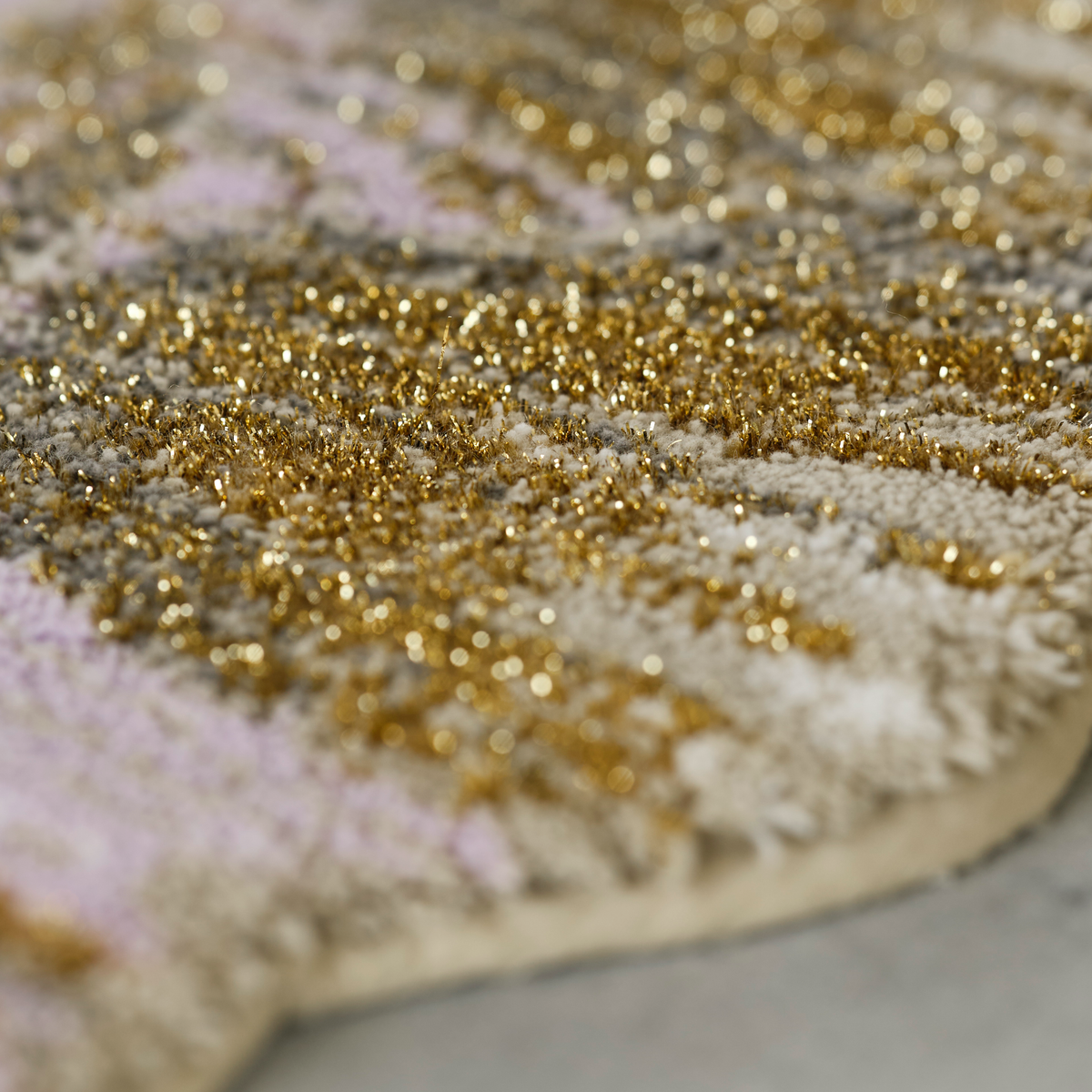 Closeup of Gold colored Abyss Habidecor Golda Bath Rug