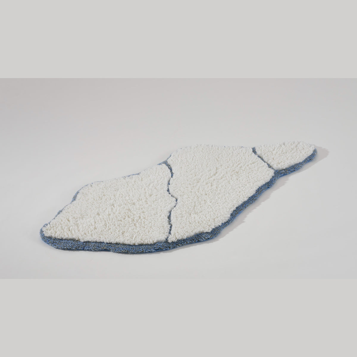 Angled View of Abyss Habidecor Jess Bath Rug in Powder Blue (330)