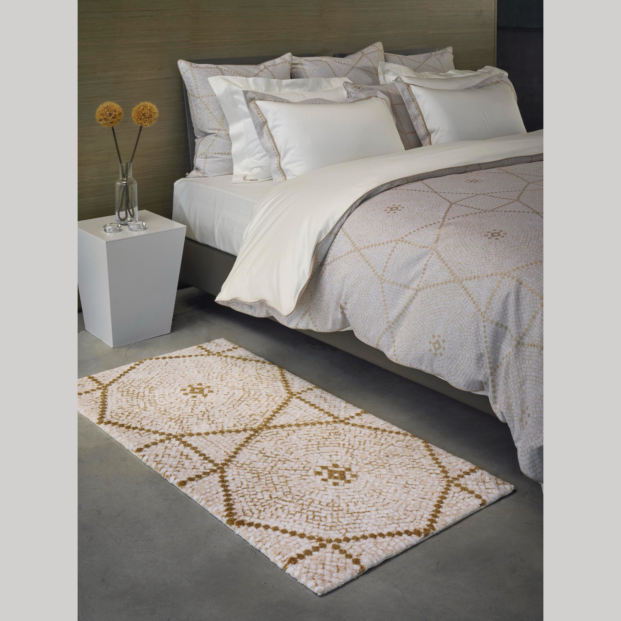 Abyss Habidecor Kery Bath Rug in Gold (800) on Bedroom Floor