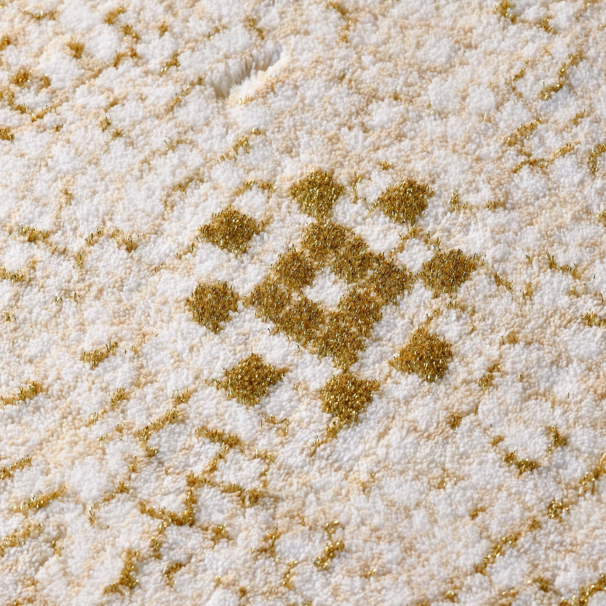 Fabric Closeup of Abyss Habidecor Kery Bath Rug in Gold (800)