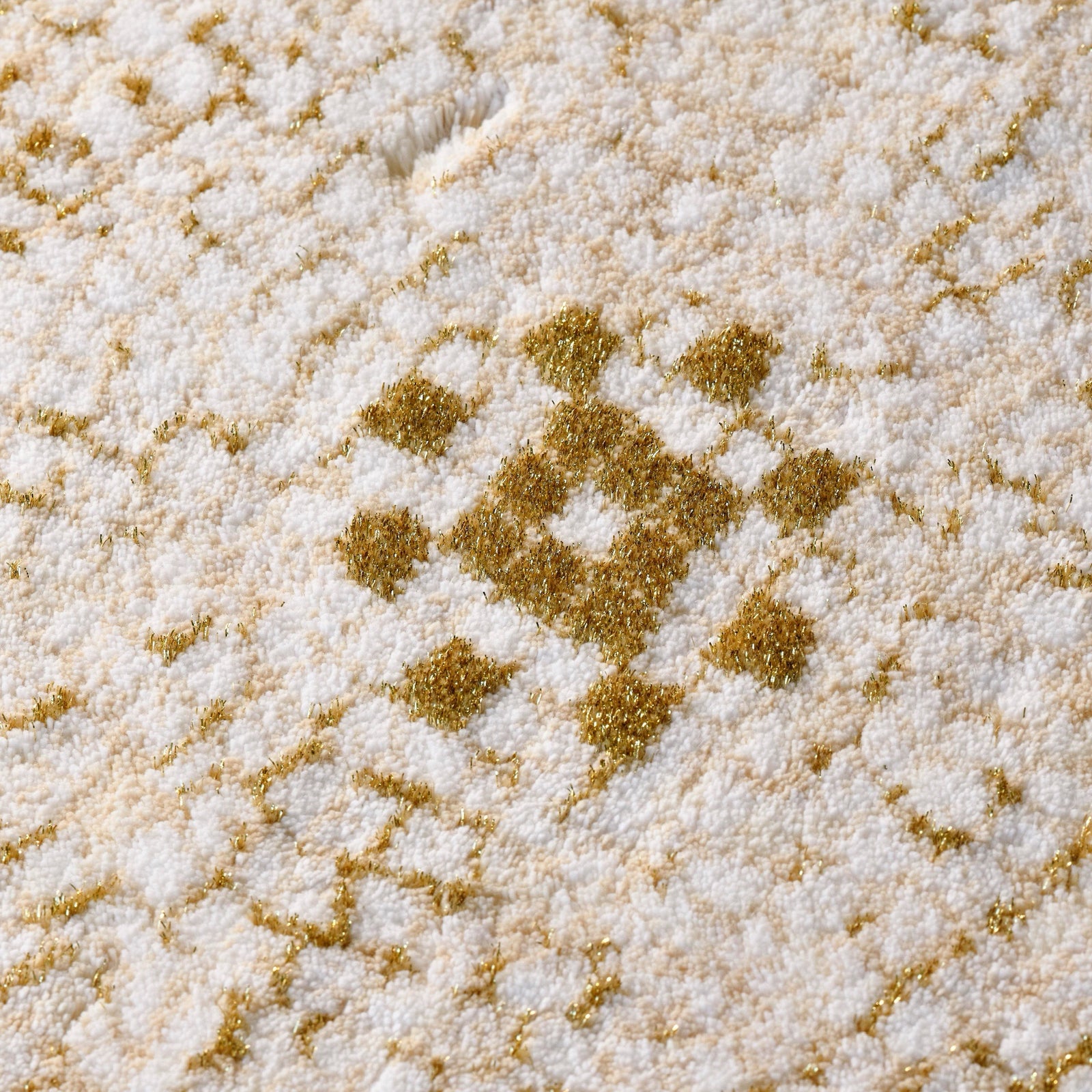 Abyss Habidecor Kery Bath Rug in Gold (800) on Bedroom Floor