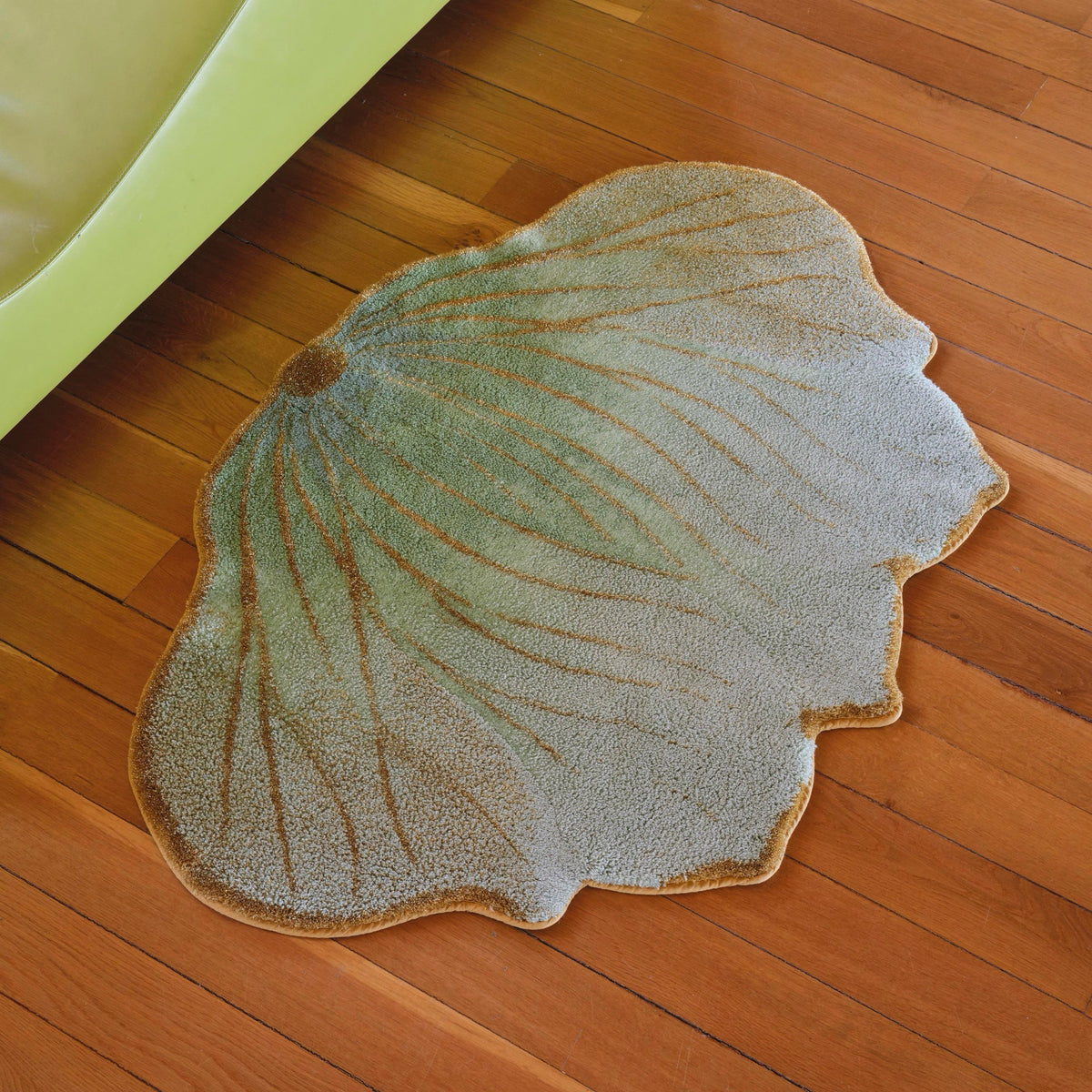 Aqua (210) Abyss Habidecor Lotus Bath Rug on wooden floor