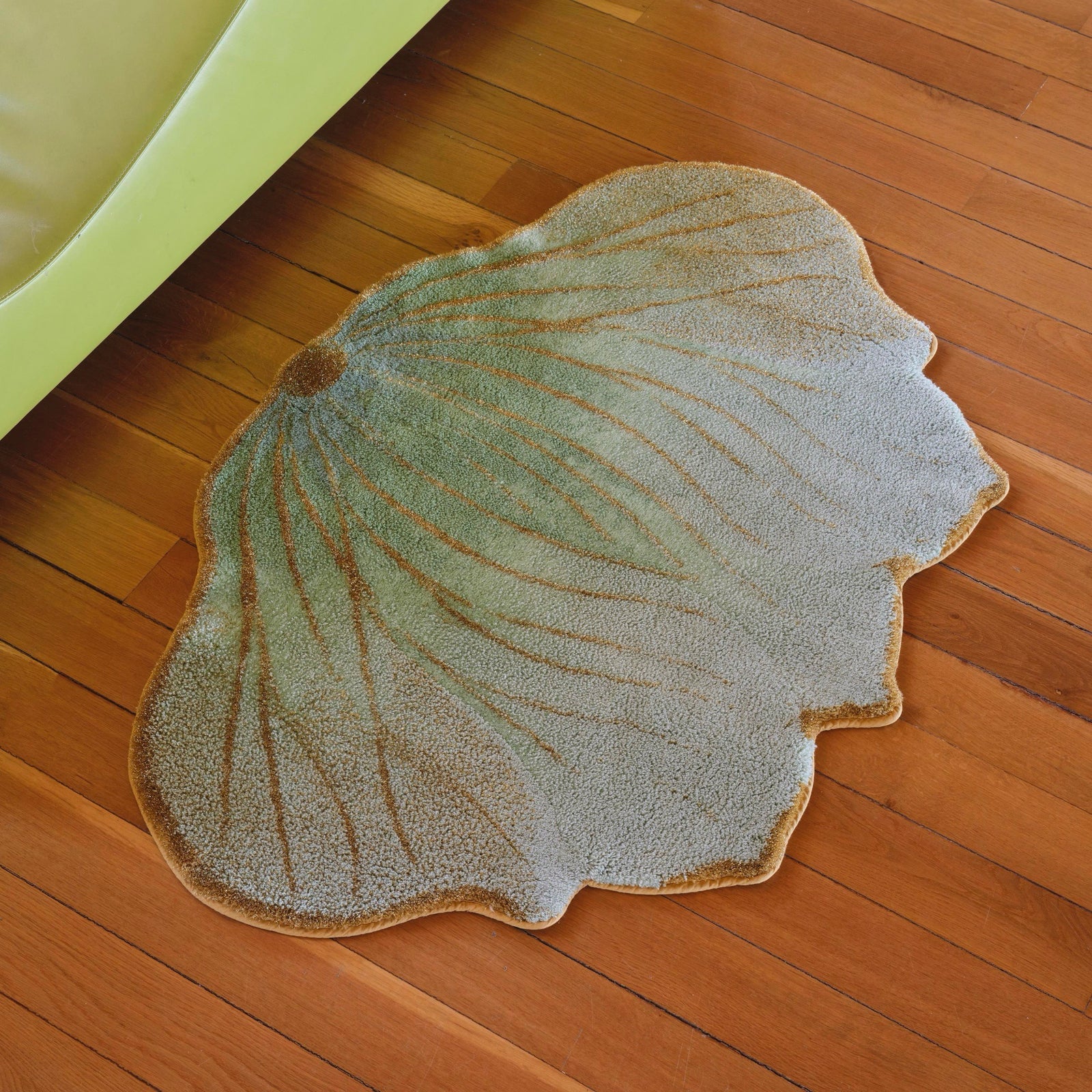 Aqua (210) Abyss Habidecor Lotus Bath Rug on wooden floor