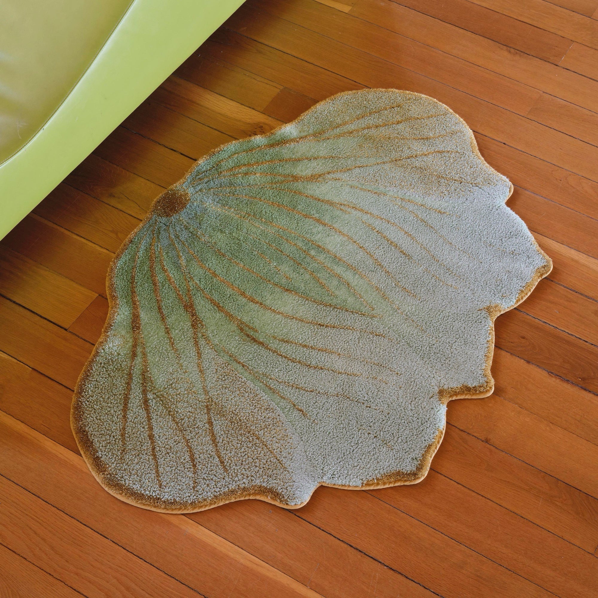 Aqua (210) Abyss Habidecor Lotus Bath Rug on wooden floor