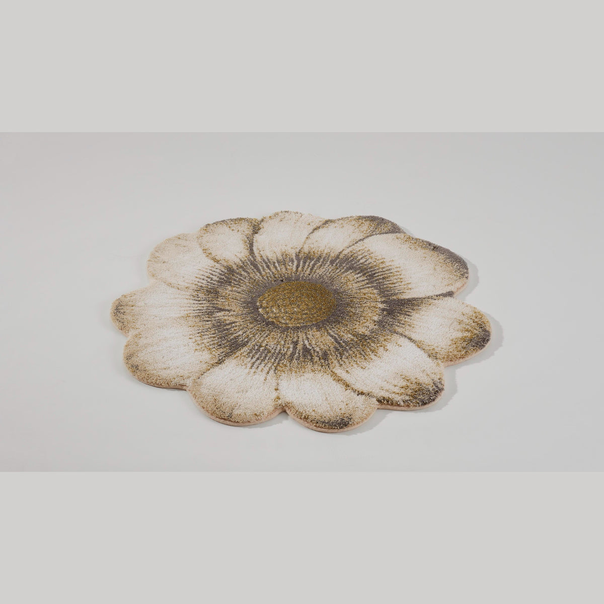 Tilted view of Sand (714) Abyss Habidecor Magnolia Bath Rug