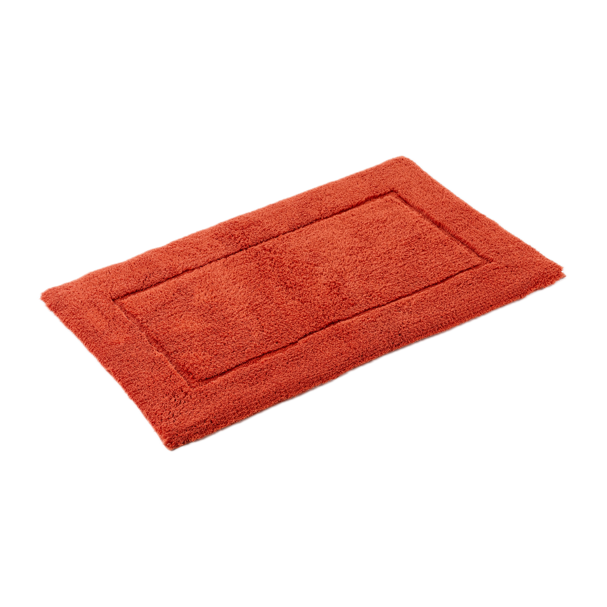 Slanted View of Abyss Habidecor Must Bath Rug in Chili Color