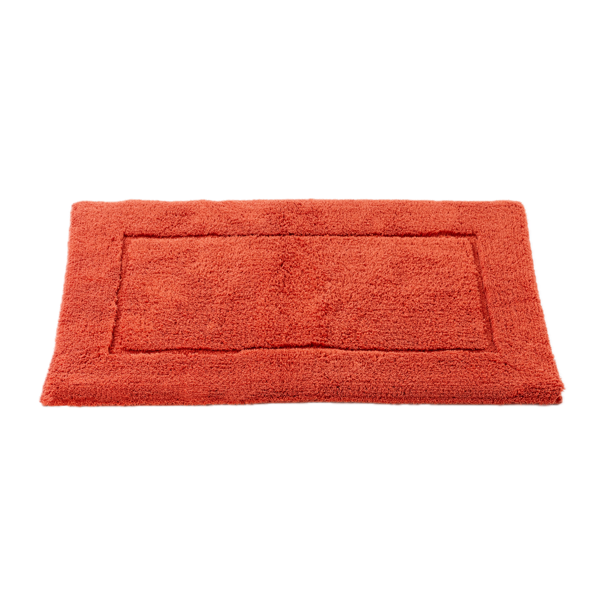 Tilted View of Abyss Habidecor Must Bath Rug in Chili Color