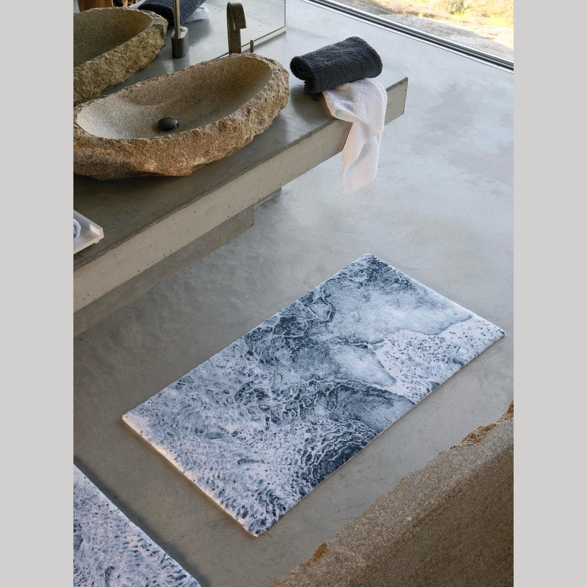 Denim (307) Abyss Habidecor Nazare Bath Rug beneath a lavatory