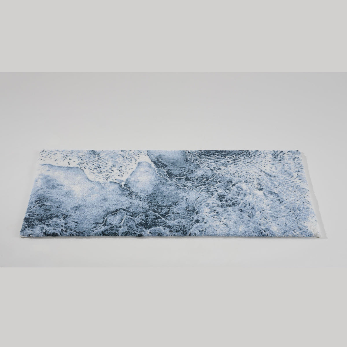 Tilted view of Denim (307) Abyss Habidecor Nazare Bath Rug