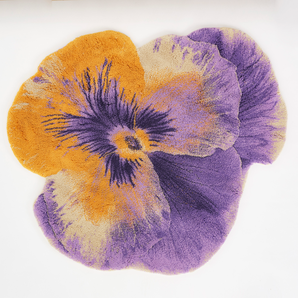 Curcuma colored Abyss Habidecor Pansy Bath Rug in Egyptian Cotton, featuring yellow, purple, and cream on a white background
