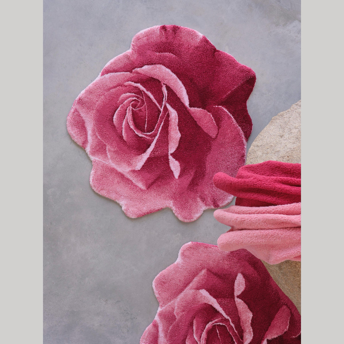 Flamingo (573) Abyss Habidecor Passion Bath Rugs on cement floor