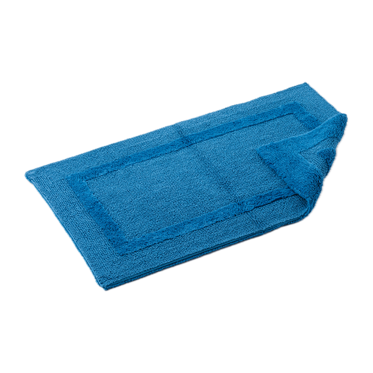 Tilted Image of Abyss Habidecor Reversible Bath Rug in Ocean Color