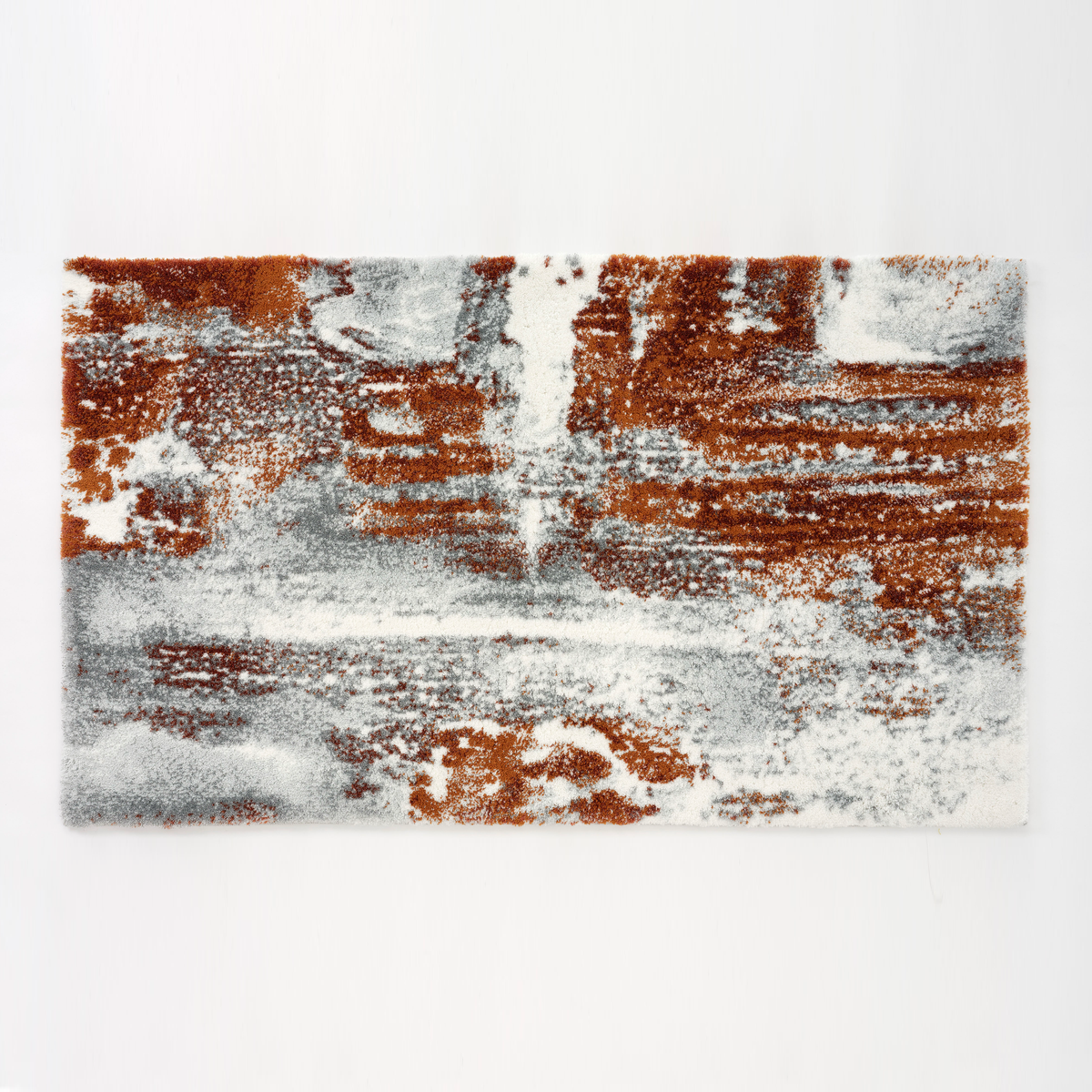 Abyss Habidecor Sparks Bath Rug: A rectangular, modern abstract bath rug in white, gray, and rust-orange tones